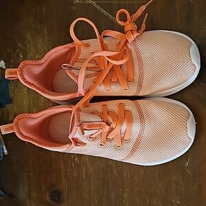 Girls adidas orange sneakers.